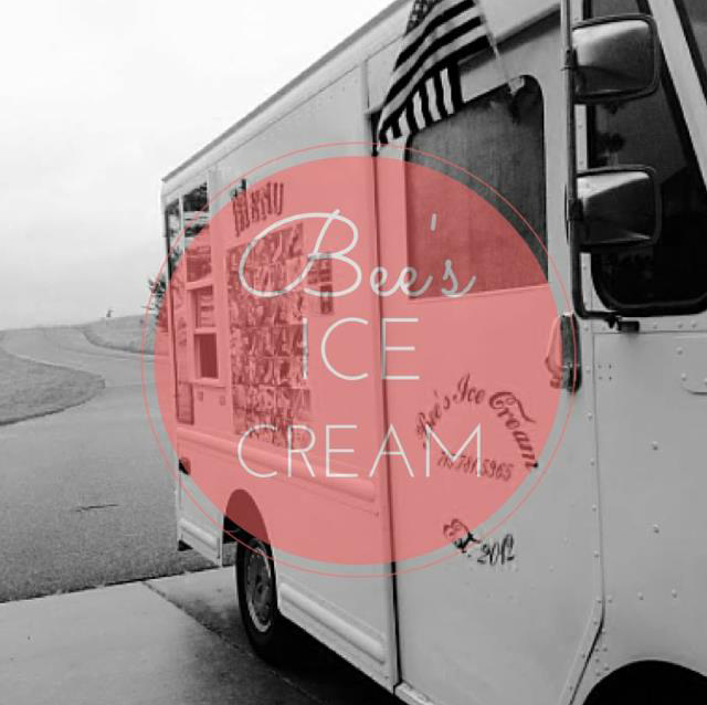 Black and white image of an ice cream truck with an American flag flying from the door. A pink translucent circle at the center highlights white letters that spell 'Bee's Ice Cream'.