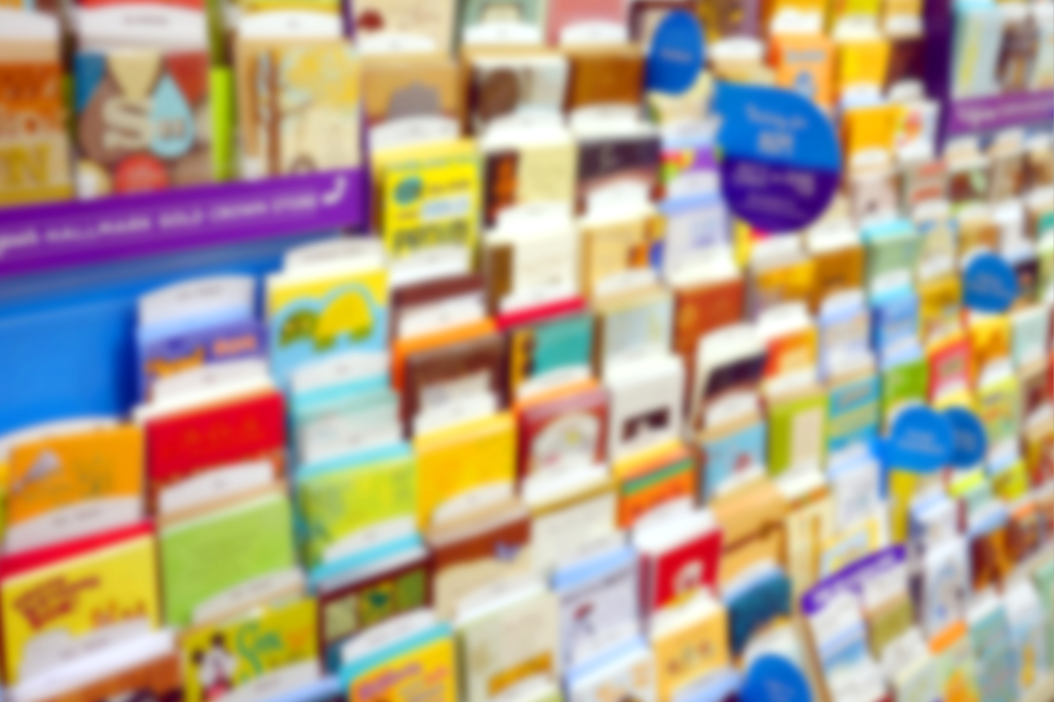 Blurred image of a greeting card display.