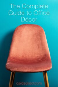 Copper chair with an orange velour seat aginst a blue background with white letters that read The Complete Guide to Office Décor.