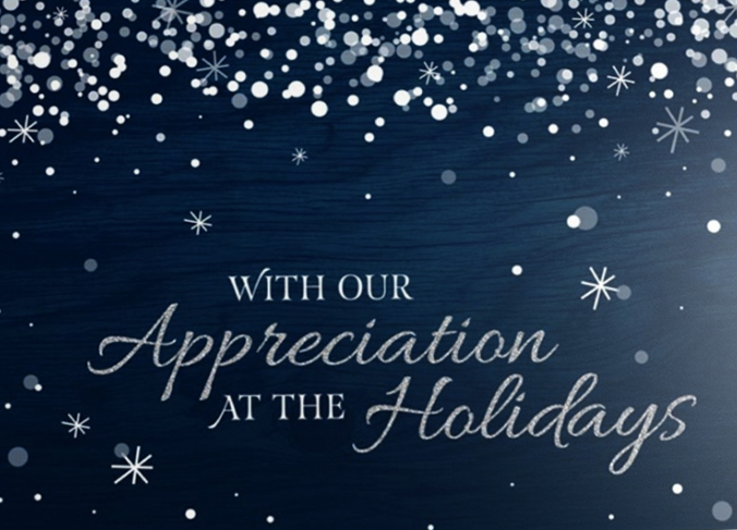 A snowstorm covers a midnight blue background, surrounding a message of 'With Our Appreciation at the Holidays' shown in elegant silver letters. The midnight blue background has a subtle wooden texture that covers both sides of the card, giving it a memorable and rustic winter feel. 