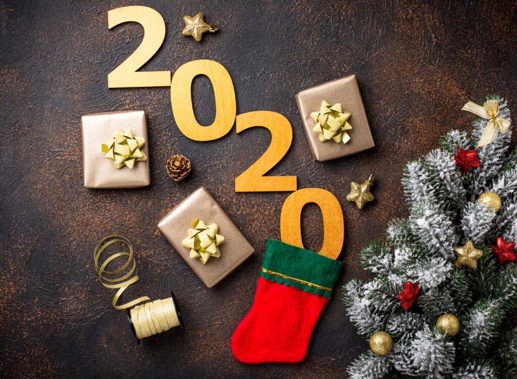 Christmas New Year 2020 background with gift boxes in golden paper