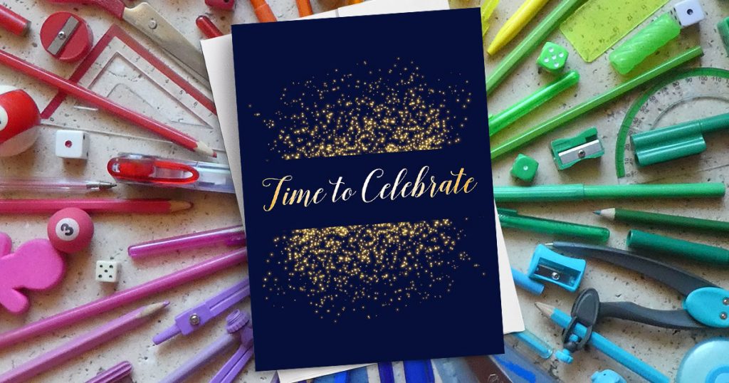 A navy blue CardsDirect card that reads 'Time to Celebrate' in gold on a colored pencil background.