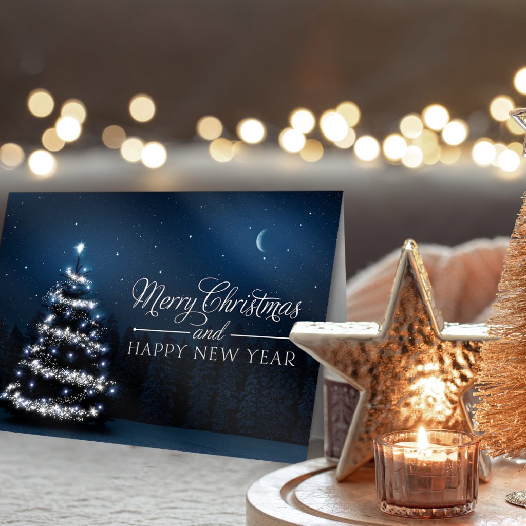 Beautiful blue Christmas card with a Christmas tree on a holiday background.