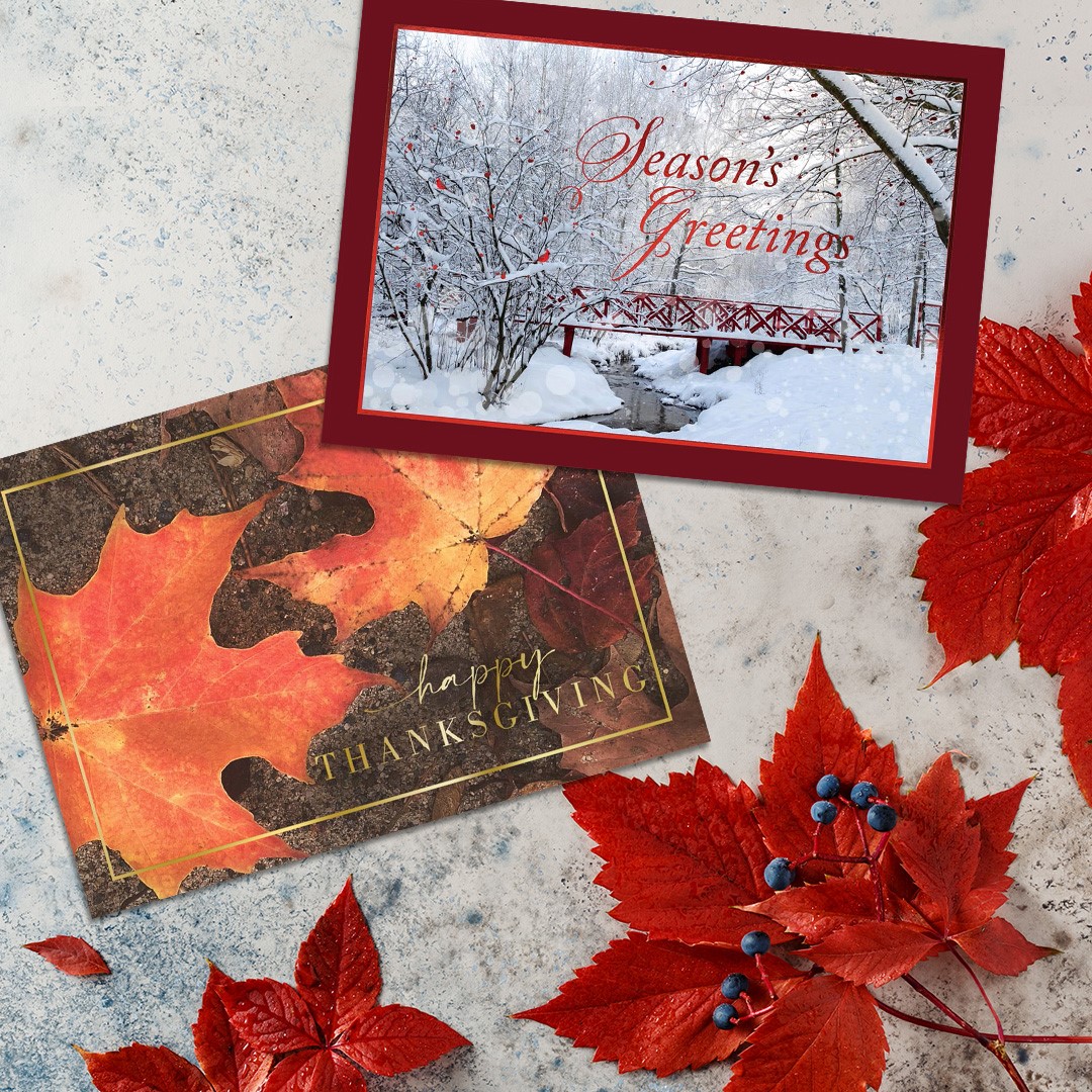 A Thanksgiving card and a holiday card on an autumn leaf background.